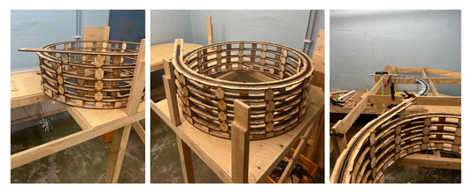 An early stage model railroad layout featuring an n scale helix built using Precision Model Railroad model train helix kit used in model railroad benchwork.