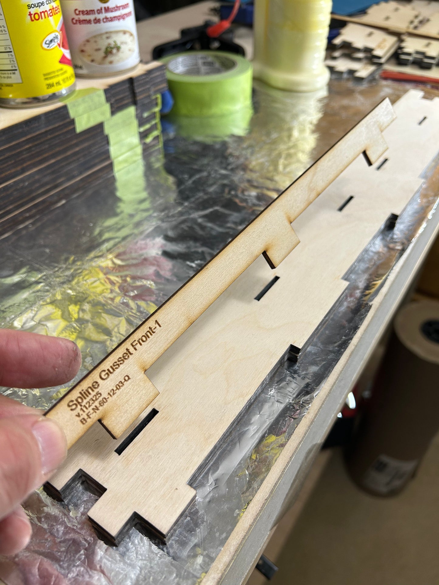 Spline gussets have tabs that fit into holes on the main girders and the ends of the main joists.